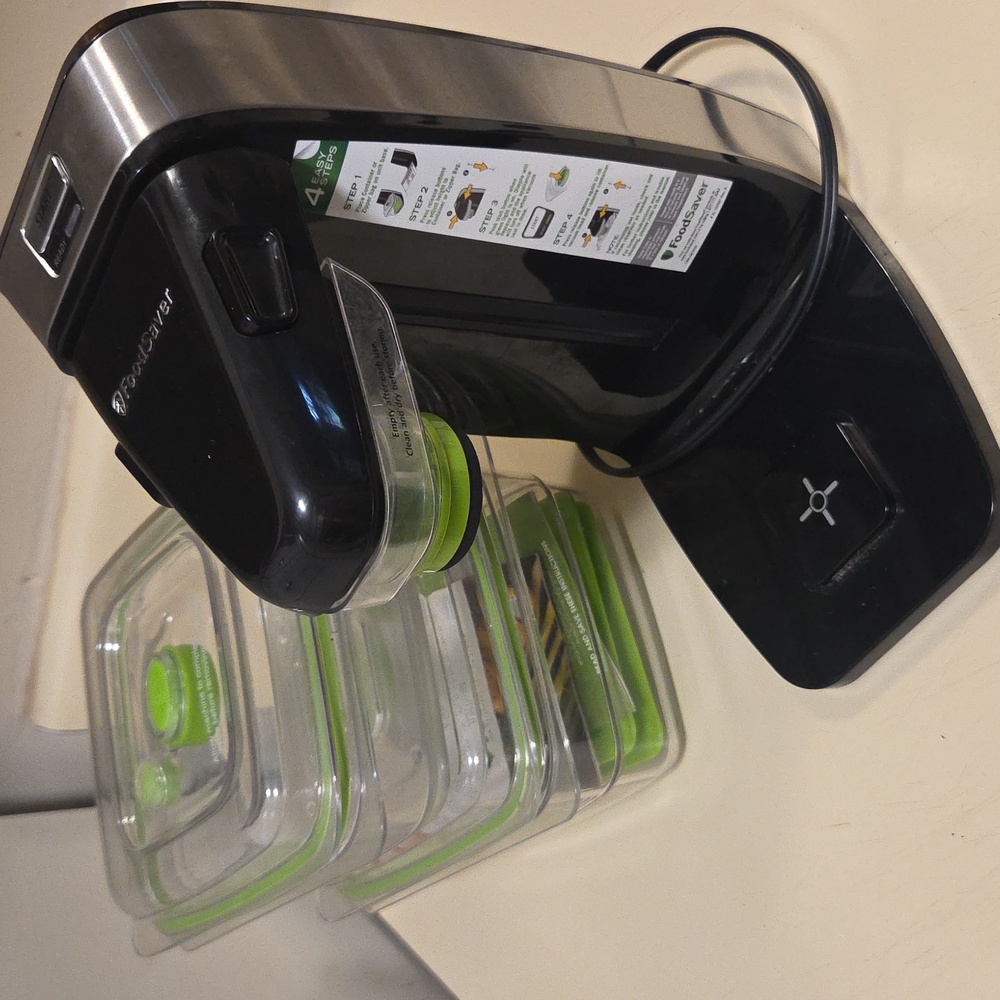 Black and Silver FoodSaver Vacuum Sealer kit.
